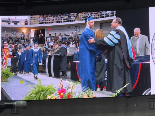 graduate shaking hands with Superintendent Dr. Ed Nichols